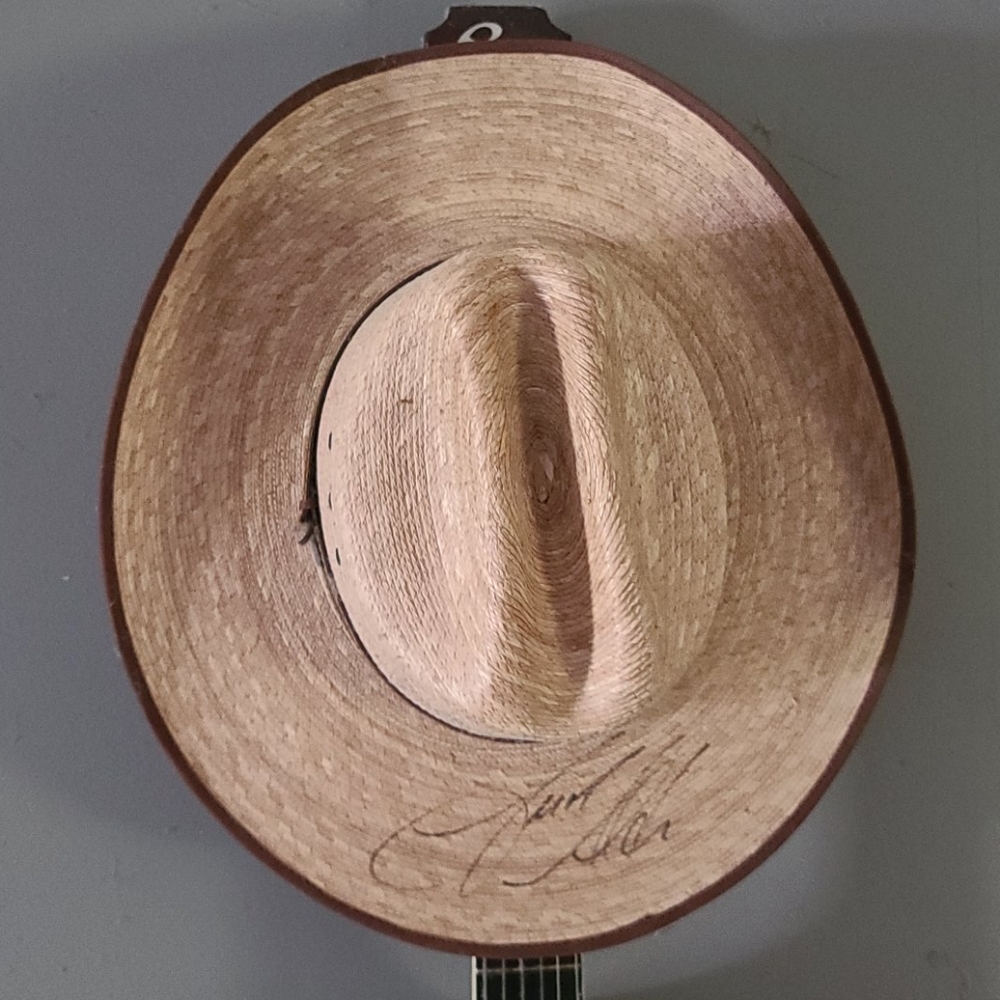 Resistol palm cowboy hat size 7 3/4 autographed.
